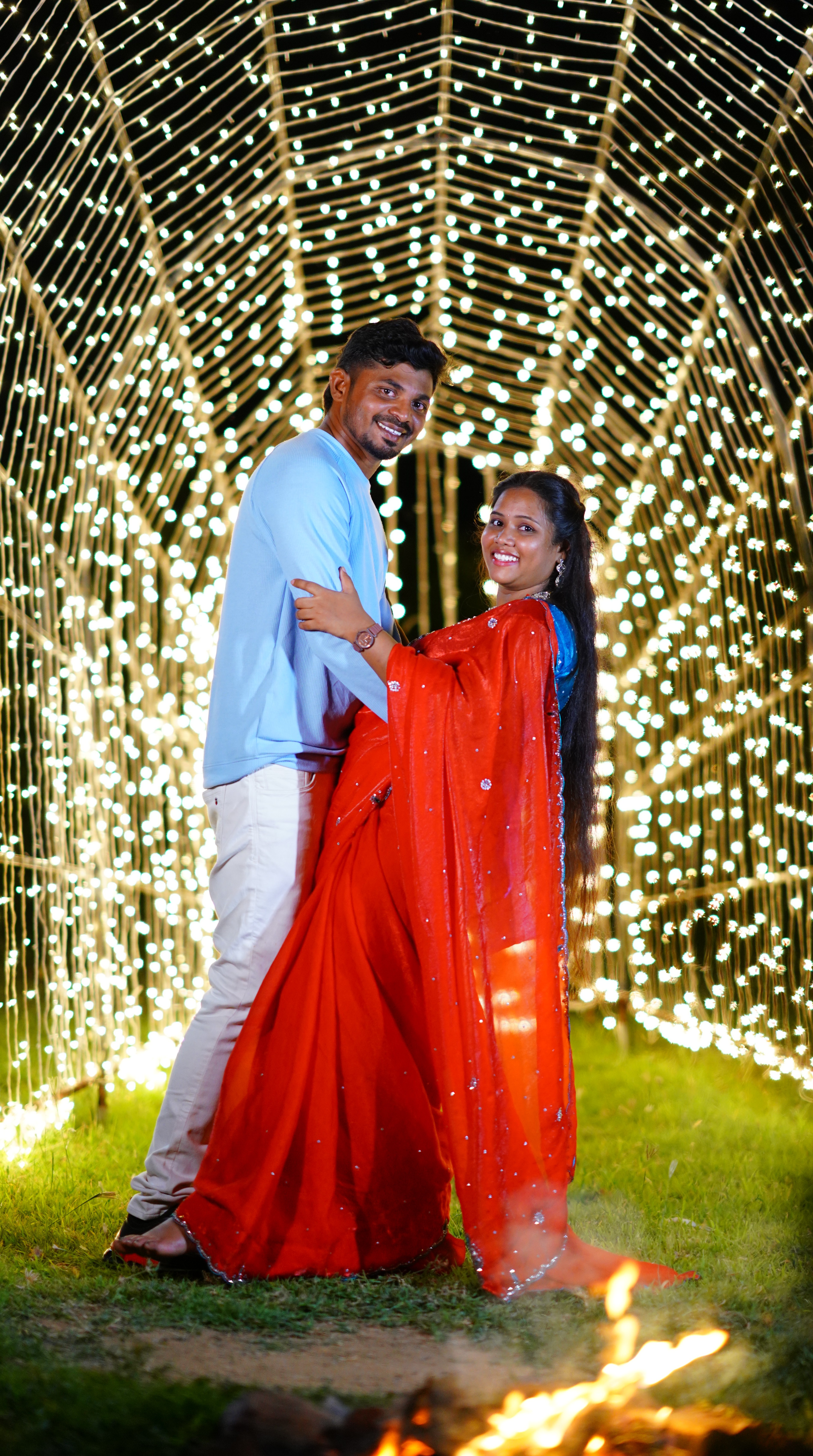 Sasi and Prem Kumar surrounded by falling petals